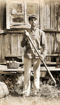 Old farmer photo in front of barn